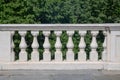 particular terrace overlooking the park with white marble balustrade on the background green plants Royalty Free Stock Photo