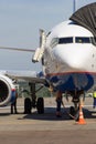 Parked airplane maintainance on airport Royalty Free Stock Photo