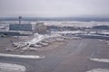 Parked airplanes at gates aerial view