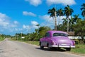 Parked american green Chevrolet classic car at the side street on the Highway to Havana Cuba - Serie Cuba Reportage