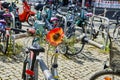 Parked bicycle with floral decorations on the handlebars near Berlin Central Station