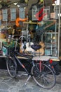 Parked bicycle in front of shop window with guitars