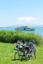 Parked Bicycles and Ferry on an Alpine lake