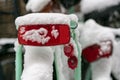 Parked bikes covered in snow in an alleyway in Dordrecht in The Netherlands. Typical dutch wintertime urban scene. Red reflectors Royalty Free Stock Photo