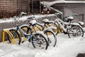 parked bikes under fallen snow