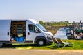Parked bus with chairs, holiday travel by camper, popular nomad traveling, Tholen, Bergse diepsluis, 22 april, 2019, The