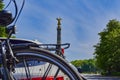 Parked car with a bike carrier attached to the stern and bicycles mounted on it. In the background you see the Berlin Siegessaeule Royalty Free Stock Photo