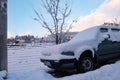 Parked Car Covered by Snow