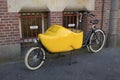 Parked cargo bike in the shape of a traditional Dutch wooden shoe