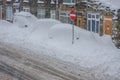 Parked cars buried in snow during a winter blizzard. Royalty Free Stock Photo