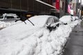 Parked Cars Buried in Snow after a Winter Snowstorm in Midtown Manhattan Royalty Free Stock Photo