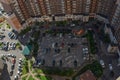 Parked cars in the courtyard of a block of flats in a new district of St. Petersburg. view from above Royalty Free Stock Photo