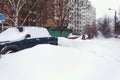 Parked cars covered in fresh snow