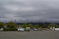 Parked cars in gas station area, with beautiful scenic landscape on background