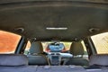 Parked cars at home. View from inside the car. Interior of a modern car with black alcantara ceiling