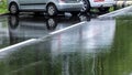 Parked cars on the outdoor parking lot after heavy rain