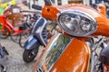 Parked colorful two-wheeled vehicles on the edge of a street festival in Berlin, Germany