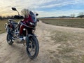 Parked CRF1000L Honda Africa Twin adventure bike on a dusty trail