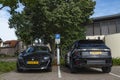 Parked Dutch Electric Vehicles charging at public charging station