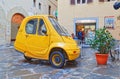 Parked electric car Pasqali in narrow street in Florence Italy Royalty Free Stock Photo