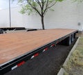 Parked flat bed semi trailer platform