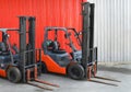 Parked Forklifts in warehouse front Royalty Free Stock Photo