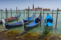 Parked gondolas and the Church of San Giorgio Maggiore in Veneto, Venice, Italy