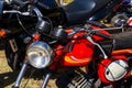 Parked old classic red motorcycle close up Royalty Free Stock Photo