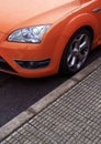 Parked orange sports car Royalty Free Stock Photo