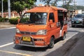 Parked red hijet pickup truck converted to carry passengers in the back Royalty Free Stock Photo