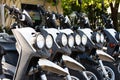 parked rental bike in row. parked rental bike black color. parked rental bike outdoor.