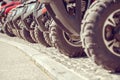 Parked in a row several atv quad bikes extreme outdoor adventure concept Royalty Free Stock Photo