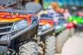 Parked in a row several atv quad bikes extreme outdoor adventure concept Royalty Free Stock Photo