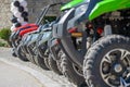 Parked in a row several atv quad bikes extreme outdoor adventure concept Royalty Free Stock Photo