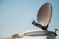 Parked satellite car tv van transmits breaking news events to orbiting satellites