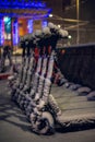 Parked segways in a snowy Milan by night