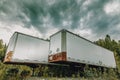 Parked semi-truck trailers on a dirt road in Alaska Royalty Free Stock Photo