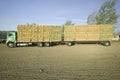 Parked truck loaded with neatly stacked hay bales