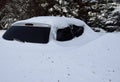 Car buried in deep snow