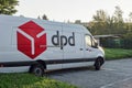 The parked white van of DPD delivery company which delivers parcels, packages and other goods