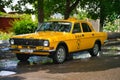 Parked yellow GAZ-24 taxi on the streets of Tiraspol, Moldova