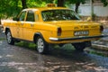 Parked yellow GAZ-24 taxi on the streets of Tiraspol, Moldova