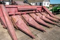 Parking agricultural machinery and harvest. rows of plows, cultivators, bodies Royalty Free Stock Photo