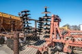 Parking agricultural machinery and harvest. rows of plows, cultivators, bodies Royalty Free Stock Photo