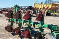 Parking agricultural machinery and harvest. rows of plows, cultivators, bodies