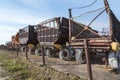 Parking agricultural machinery and harvest. rows of plows, cultivators, bodies Royalty Free Stock Photo