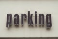 Parking area sign on building in the street Royalty Free Stock Photo