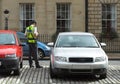 Parking attendant, traffic warden, getting ticket fine mandate Royalty Free Stock Photo