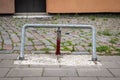 Parking barrier with padlock. Paved area