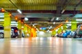Parking car blurred. Empty road asphalt background in soft focus. Car lot parking space in underground city garage Royalty Free Stock Photo
